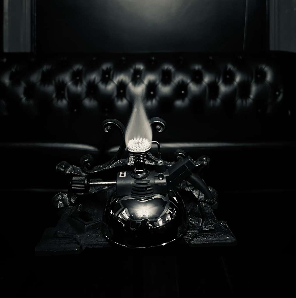 A still of an antique table lighter — The Continental — White Russian